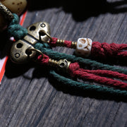 Detail view of Inlaid Barrel Bead Tibetan Bracelet with Tassel Charms (4 of 6)