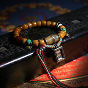 Detail view of Golden Brown Tibetan Bracelet with Amulet Charm (4 of 6)