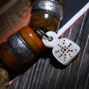 Detail view of Barrel Bead Tibetan Buddhist Bracelet with Metal Bands (3 of 6)