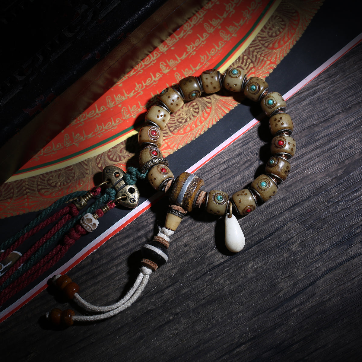 Detail view of Inlaid Barrel Bead Tibetan Bracelet with Tassel Charms (2 of 6)
