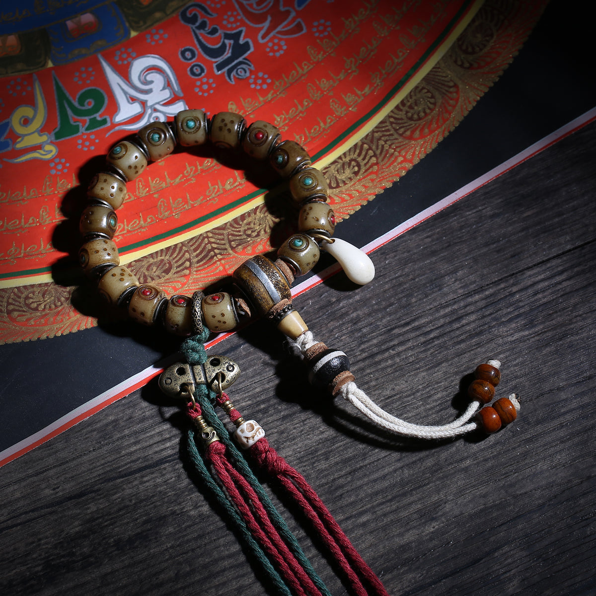 Detail view of Inlaid Barrel Bead Tibetan Bracelet with Tassel Charms (3 of 6)
