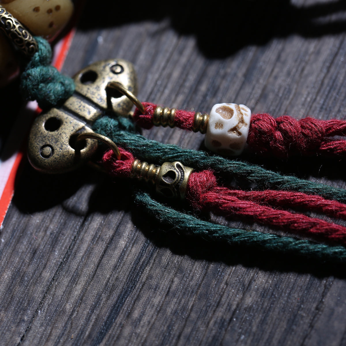 Detail view of Inlaid Barrel Bead Tibetan Bracelet with Tassel Charms (4 of 6)
