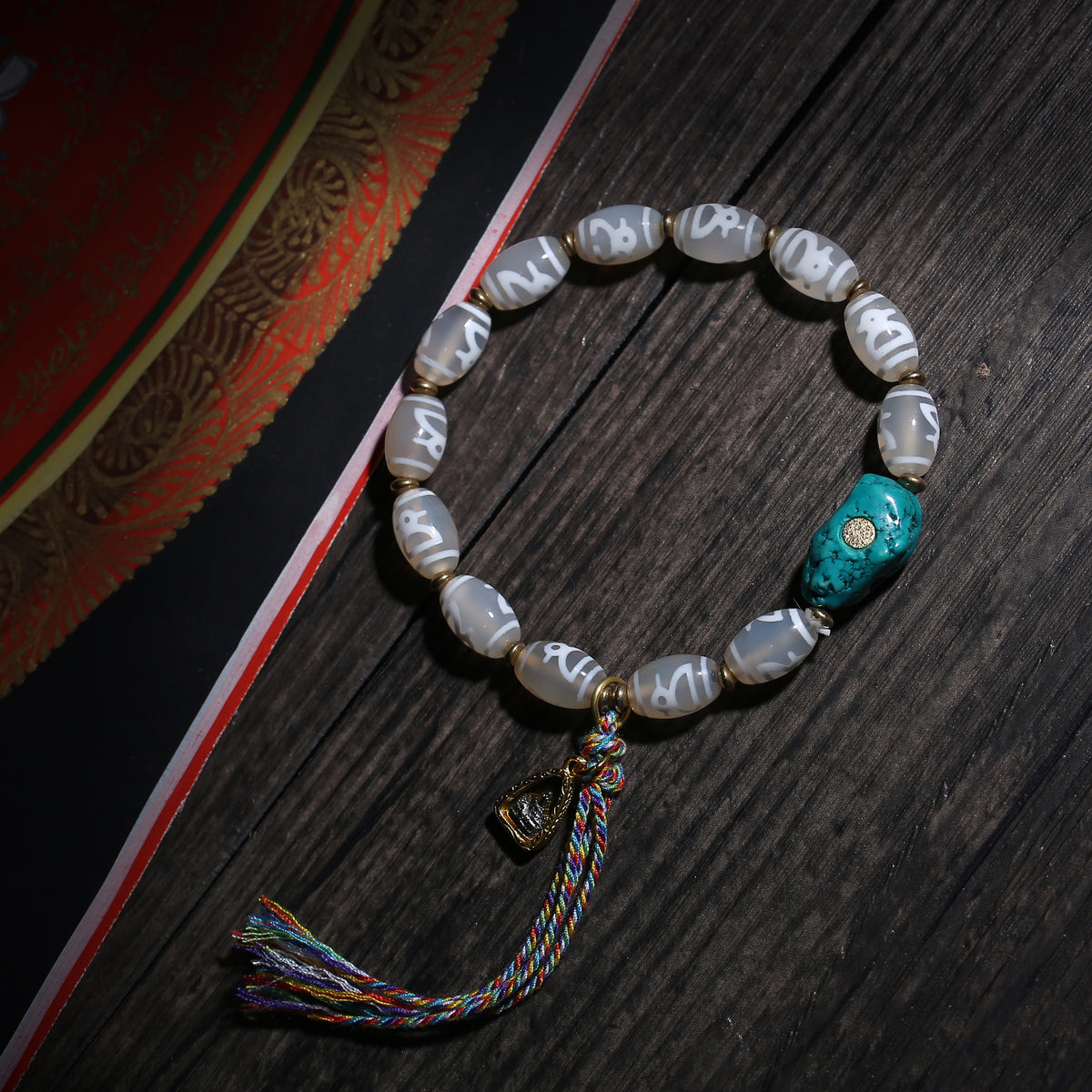 Gray Dzi-Style Buddhist Bracelet with Turquoise Accent