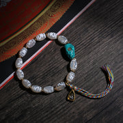 Detail view of Gray Dzi-Style Buddhist Bracelet with Turquoise Accent (2 of 6)