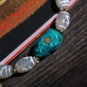 Detail view of Gray Dzi-Style Buddhist Bracelet with Turquoise Accent (4 of 6)