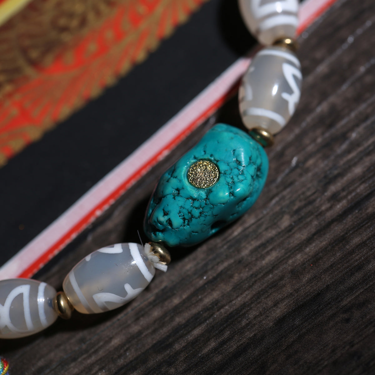 Detail view of Gray Dzi-Style Buddhist Bracelet with Turquoise Accent (4 of 6)