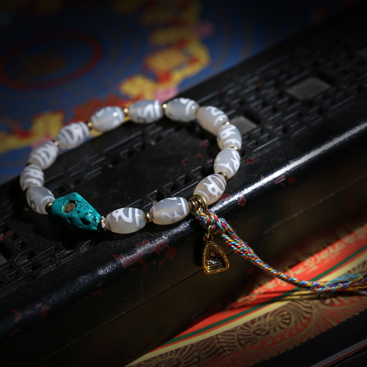 Detail view of Gray Dzi-Style Buddhist Bracelet with Turquoise Accent (5 of 6)