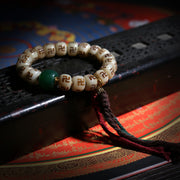 Carved Symbol Bead Buddhist Bracelet with Green Accent