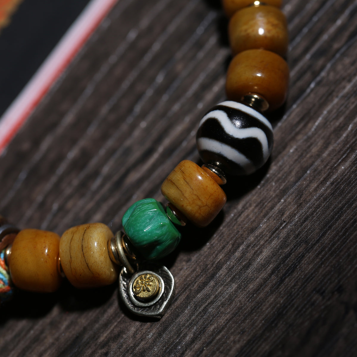 Detail view of Golden Brown Tibetan Bracelet with Amulet Charm (3 of 6)