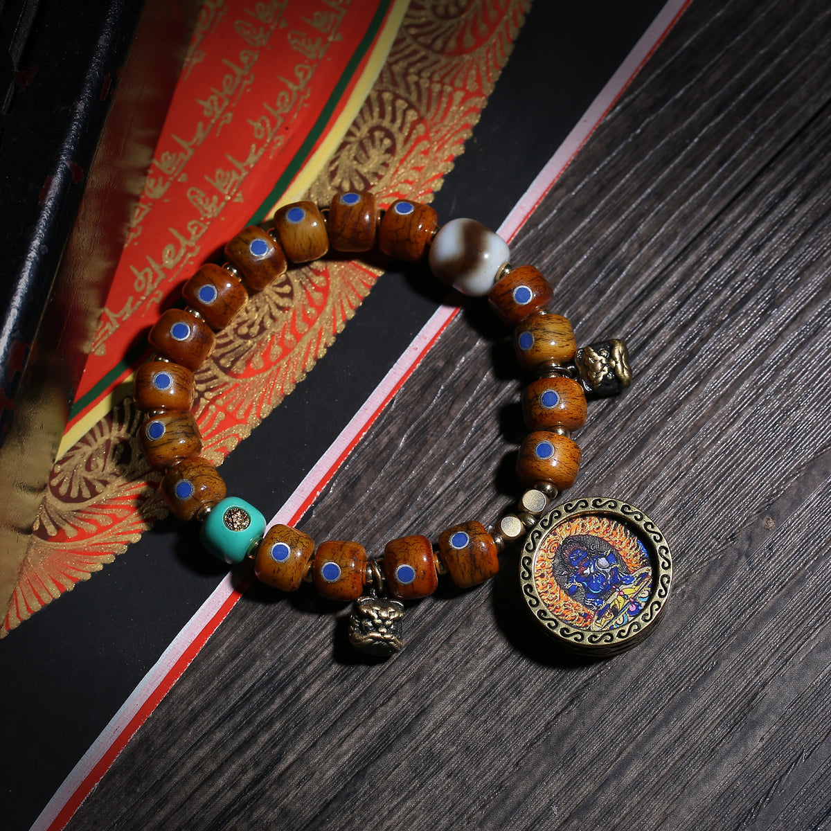 Detail view of Brown Inlaid Bead Tibetan Bracelet with Medallion Charm (2 of 6)