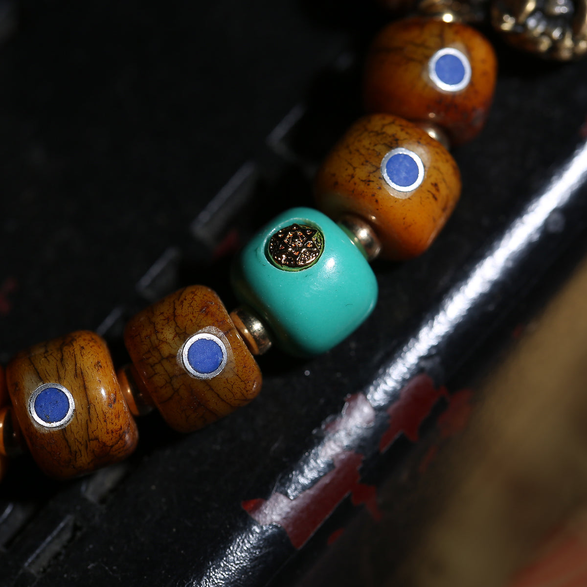 Detail view of Brown Inlaid Bead Tibetan Bracelet with Medallion Charm (4 of 6)