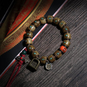 Turquoise-Inlaid Buddhist Bracelet with Amulet Charms