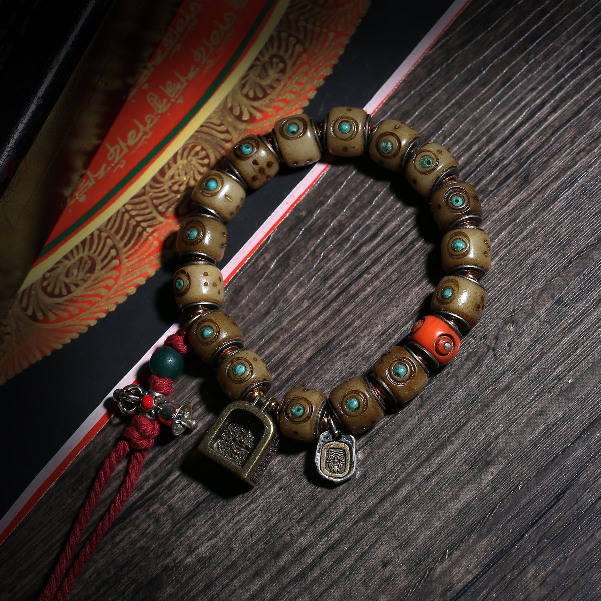 Turquoise-Inlaid Buddhist Bracelet with Amulet Charms