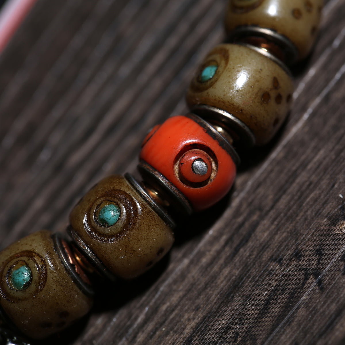 Detail view of Turquoise-Inlaid Buddhist Bracelet with Amulet Charms (3 of 6)