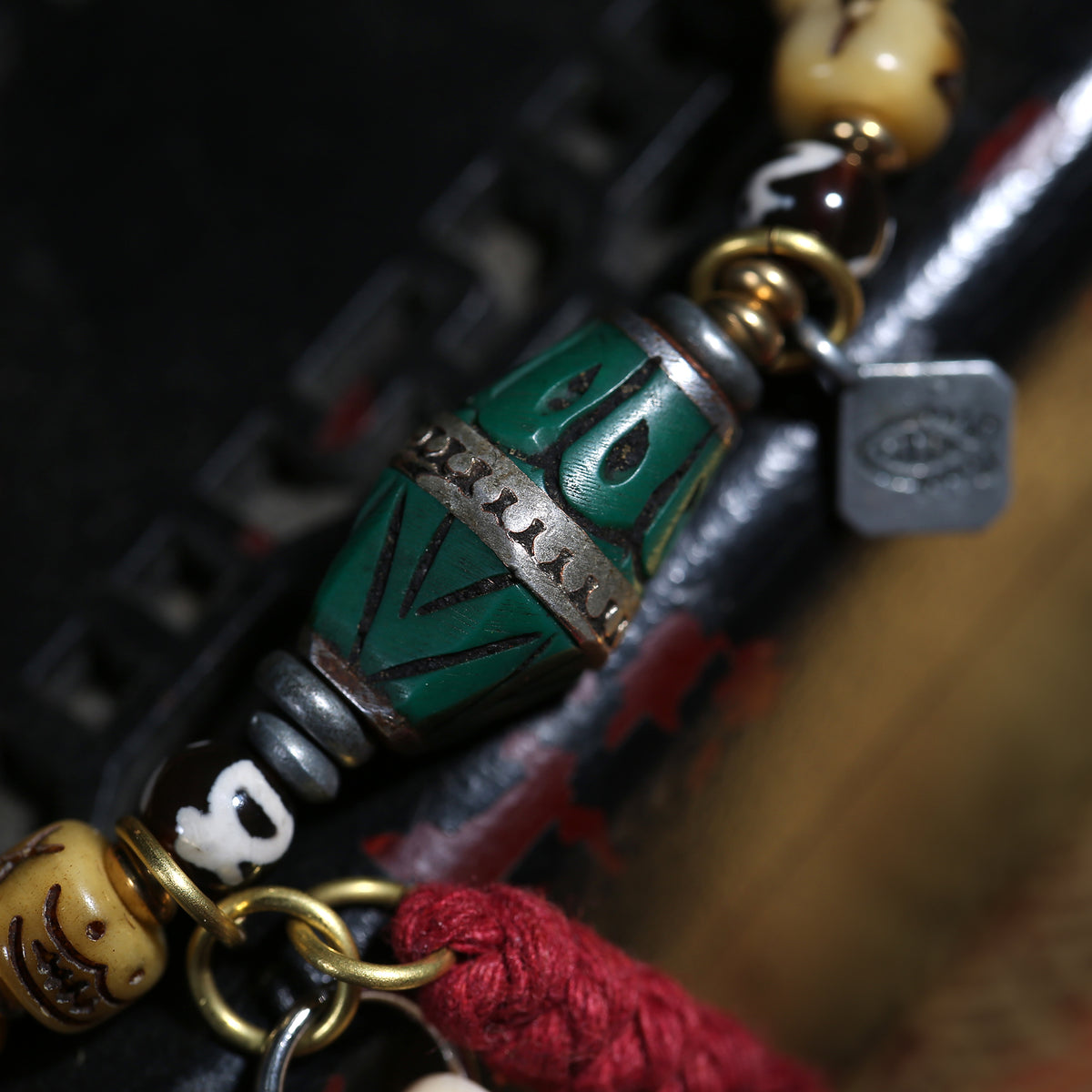 Detail view of Carved Cream Bead Tibetan Bracelet with Green Accent (2 of 6)