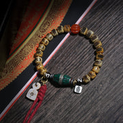Detail view of Carved Cream Bead Tibetan Bracelet with Green Accent (3 of 6)