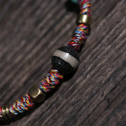 Detail view of Multicolor Cord Buddhist Bracelet with Amulet Charm (3 of 6)