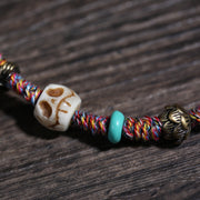 Detail view of Multicolor Cord Buddhist Bracelet with Amulet Charm (4 of 6)