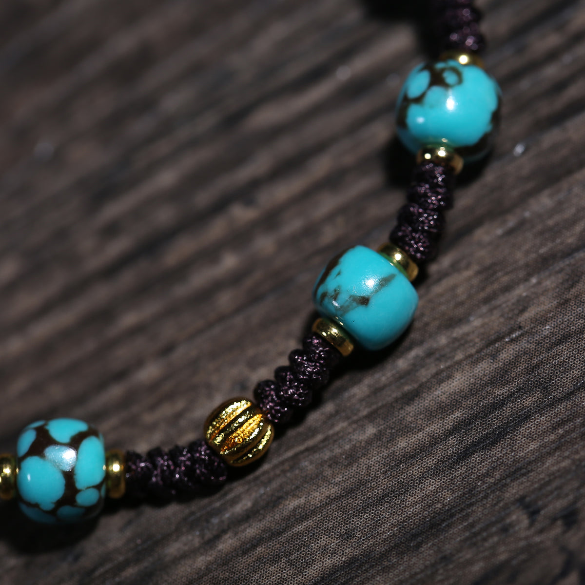Detail view of Turquoise-Color Tibetan Bracelet with Dzi-Style Centerpiece (3 of 6)
