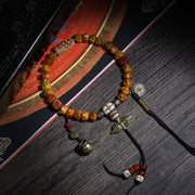 Detail view of Golden Brown Handheld Buddhist Prayer Beads with Charms (2 of 6)