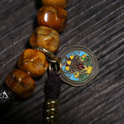 Detail view of Golden Brown Handheld Buddhist Prayer Beads with Charms (3 of 6)