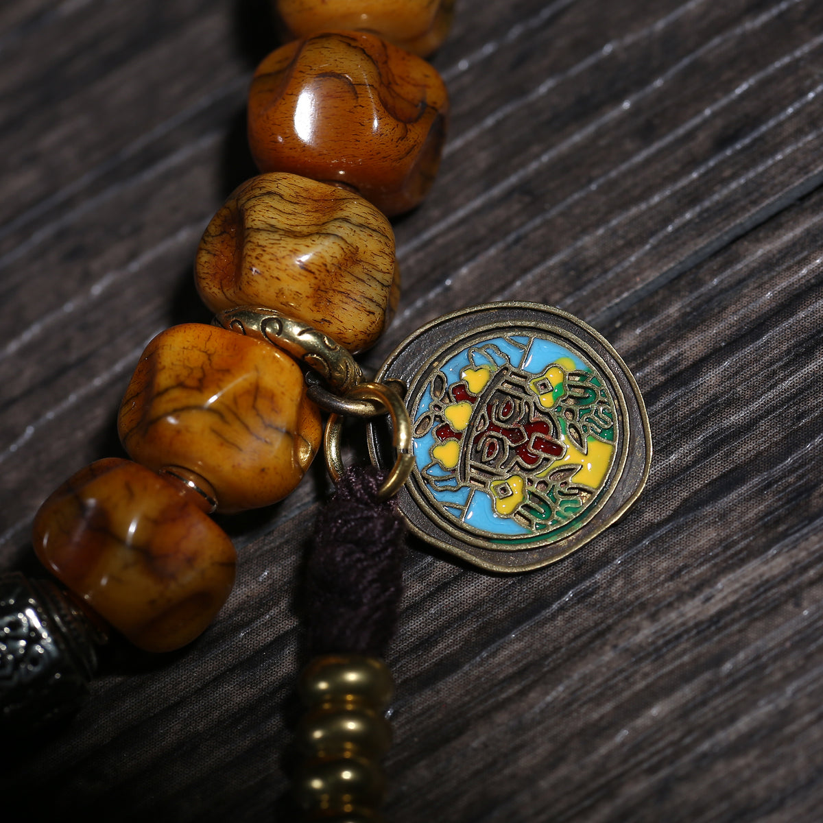 Detail view of Golden Brown Handheld Buddhist Prayer Beads with Charms (3 of 6)
