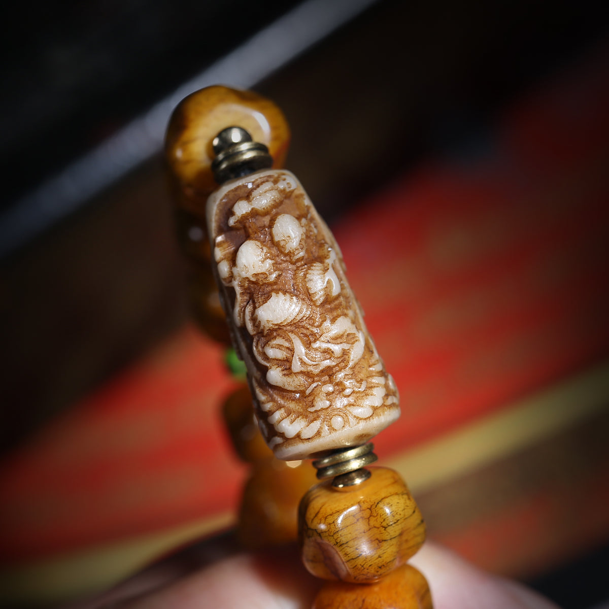 Detail view of Golden Brown Handheld Buddhist Prayer Beads with Charms (5 of 6)
