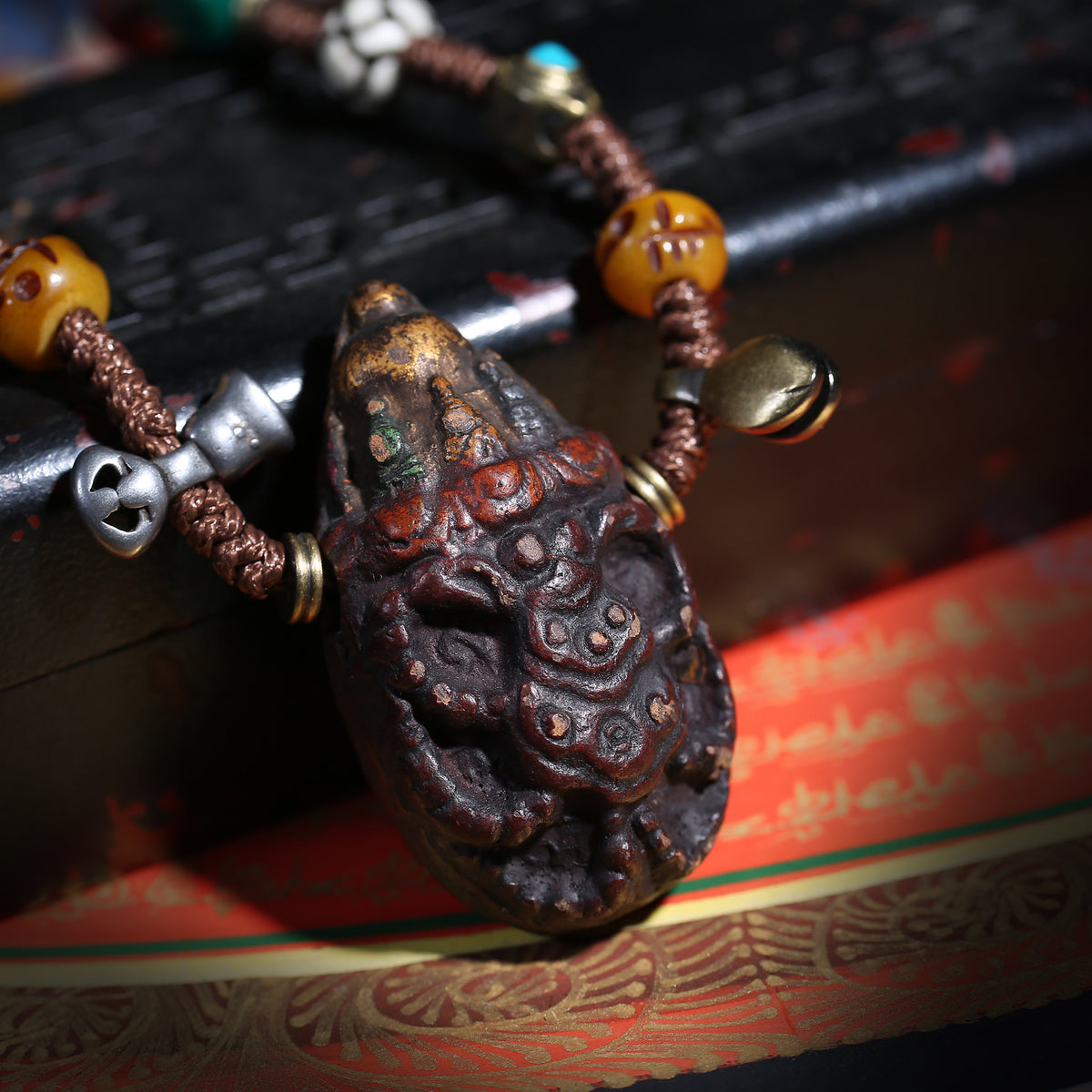 Detail view of Carved Tibetan Necklace with Turquoise-Color Amulet (3 of 7)