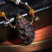 Detail view of Carved Tibetan Necklace with Turquoise-Color Amulet (3 of 7)
