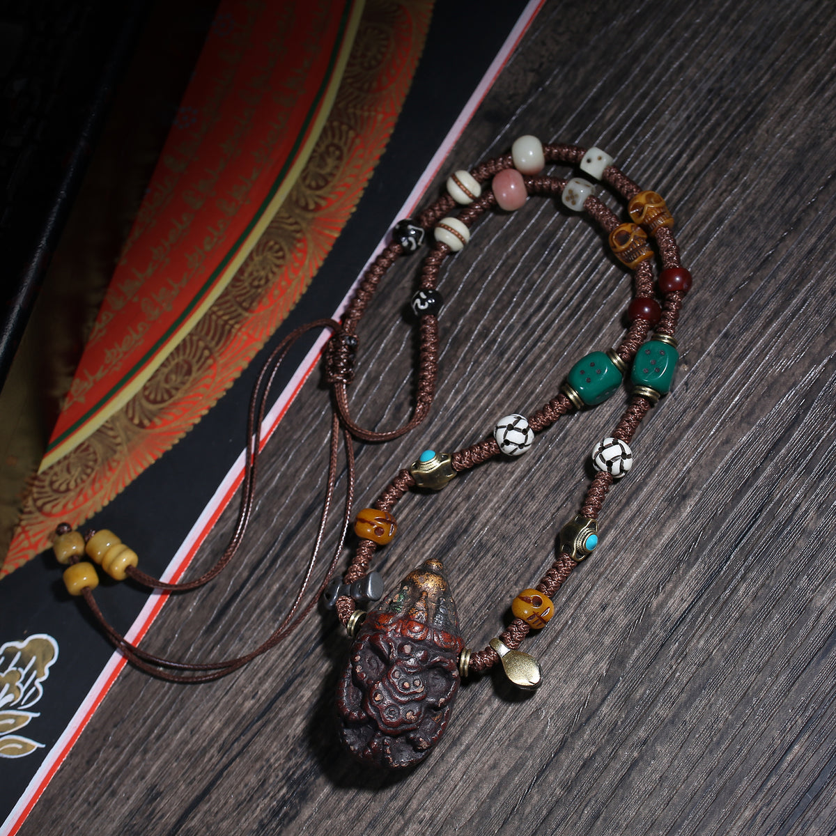 Detail view of Carved Tibetan Necklace with Turquoise-Color Amulet (4 of 7)