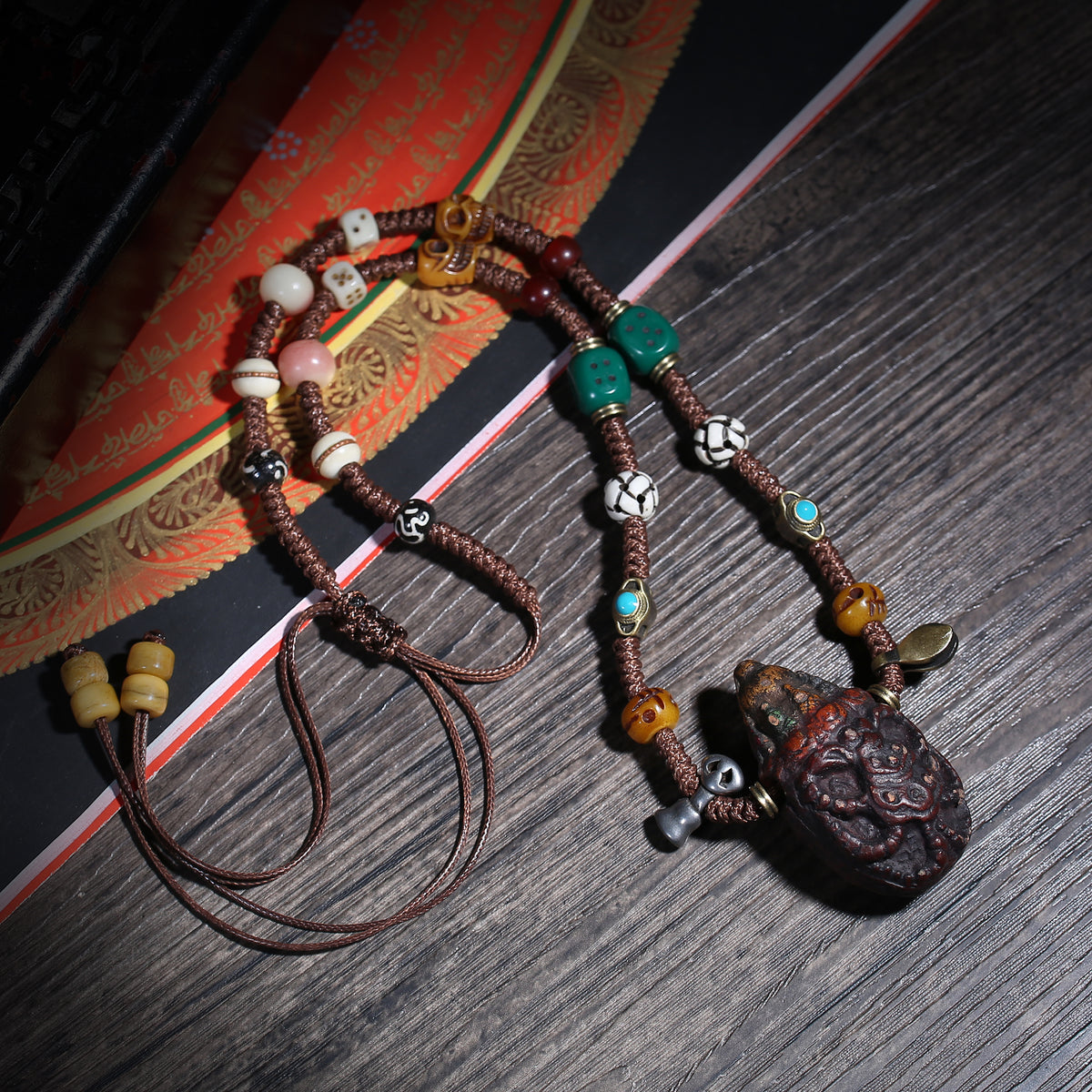 Detail view of Carved Tibetan Necklace with Turquoise-Color Amulet (5 of 7)