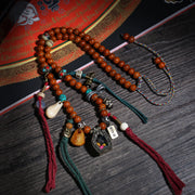 Detail view of Tibetan Bead Necklace with Framed Amulet Pendant (3 of 6)